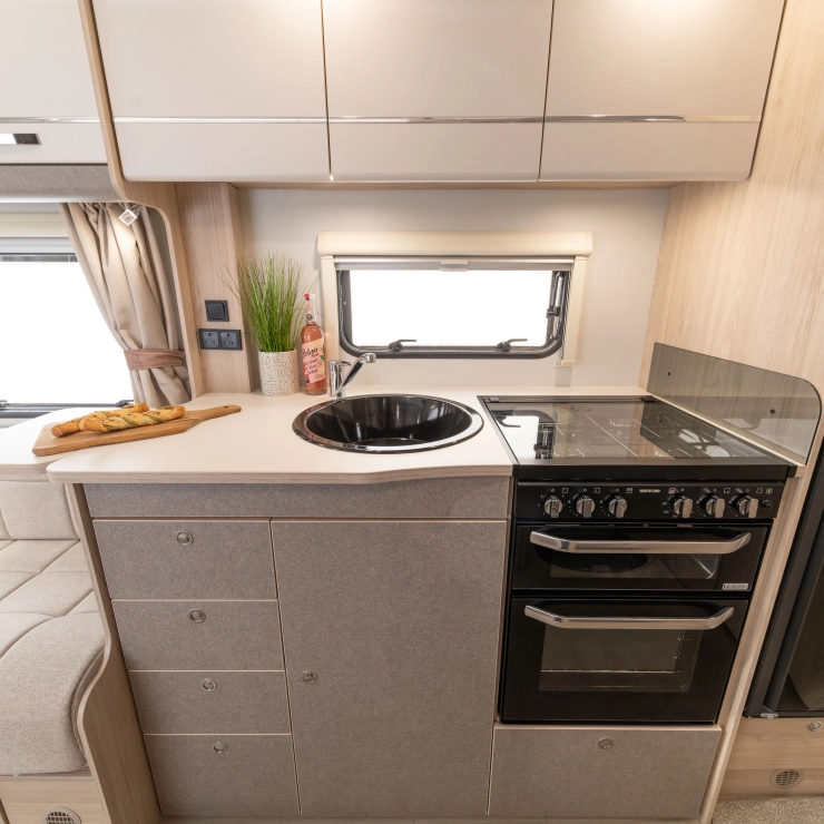 Front view of the kitchen area inside the Whirlwind 520 model by Elddis.