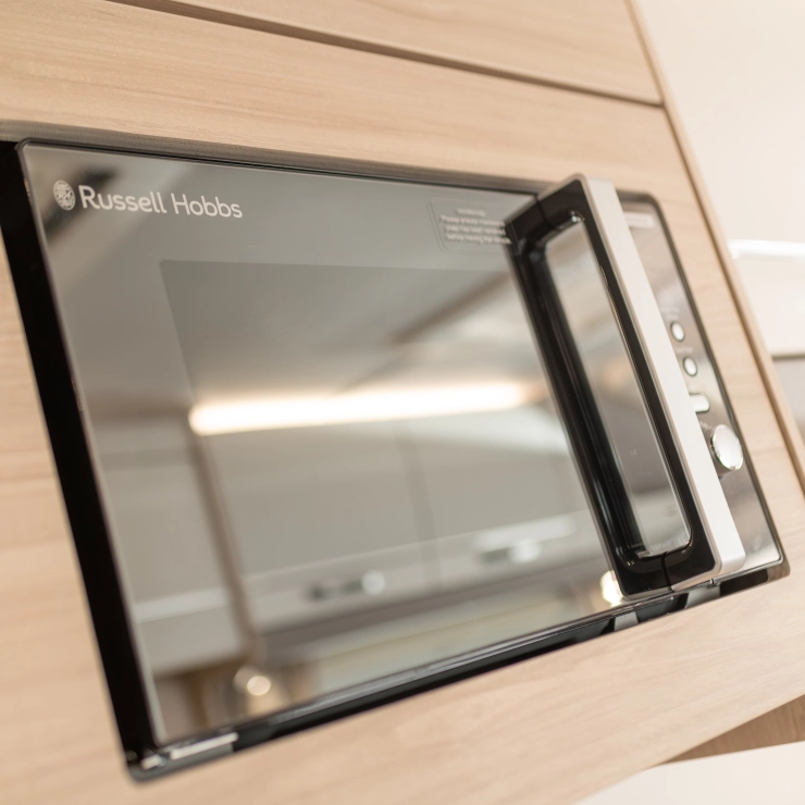 Image of the Russell Hobbs microwave inside a Whirlwind caravan 2026 model by Elddis.