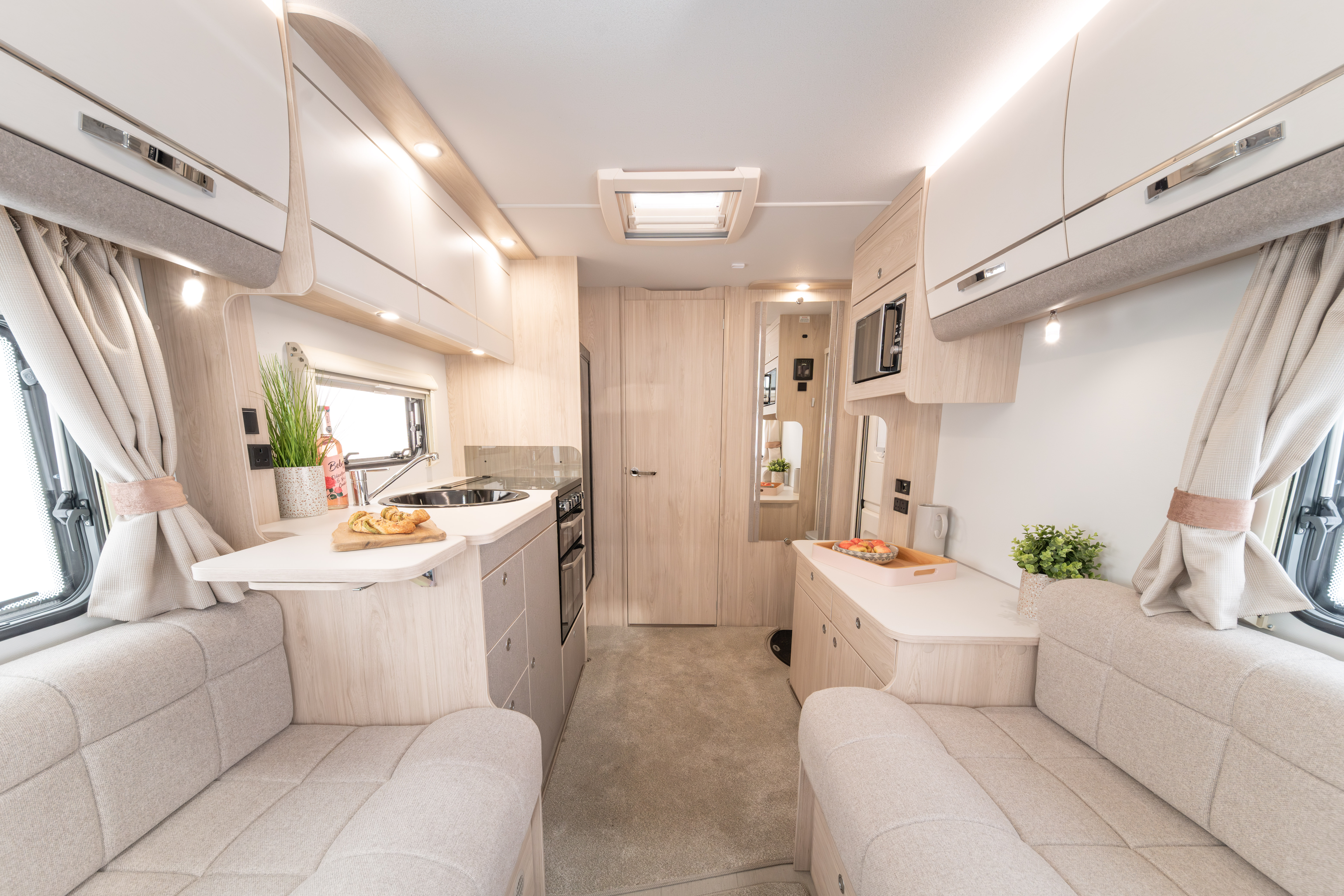 Interior image of the Elddis Whirlwind. It shows the lounge and kitchen area.