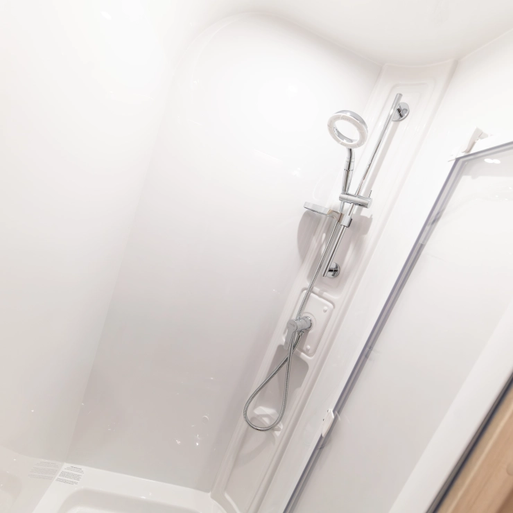 An image of the rear bathroom inside the Elddis Whirlwind 520 caravan. It shows the shower area of the bathroom.