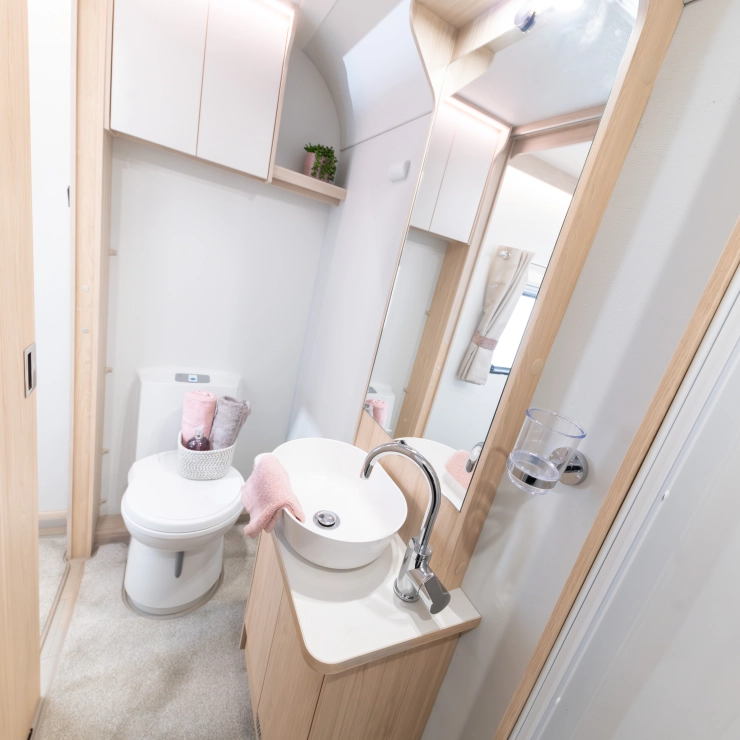 Different angle showcasing the Full-width rear washroom inside the Whirlwind 554.